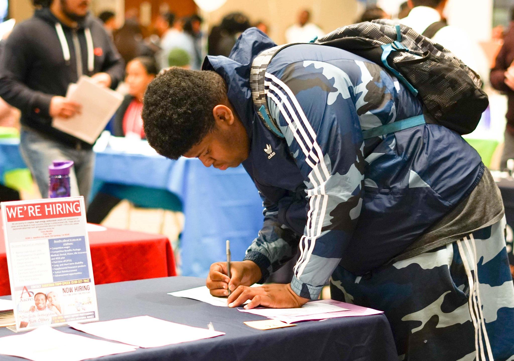 a YouthBuild student filling out a job application