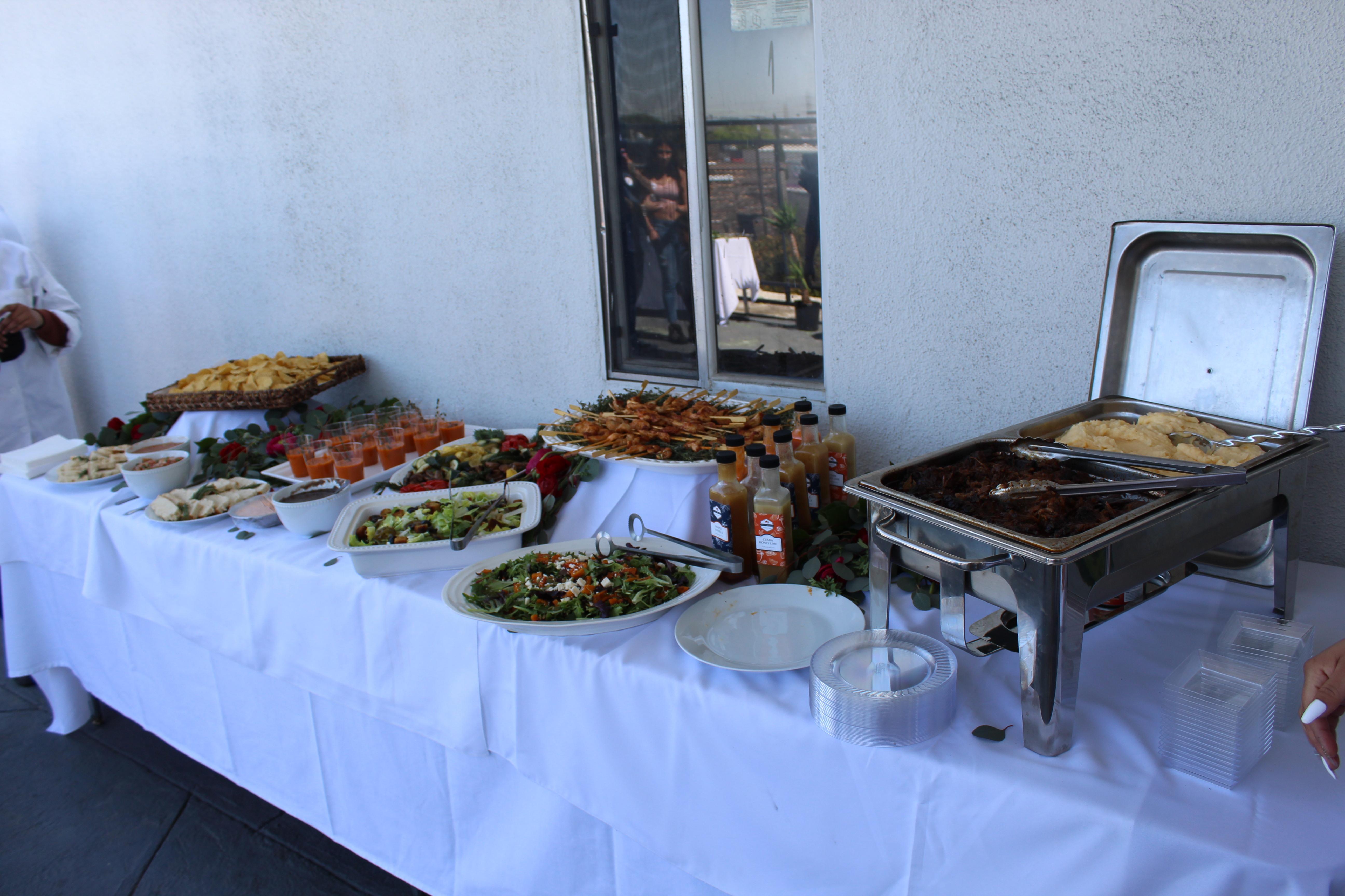 buffet table with food cooked by culinary students