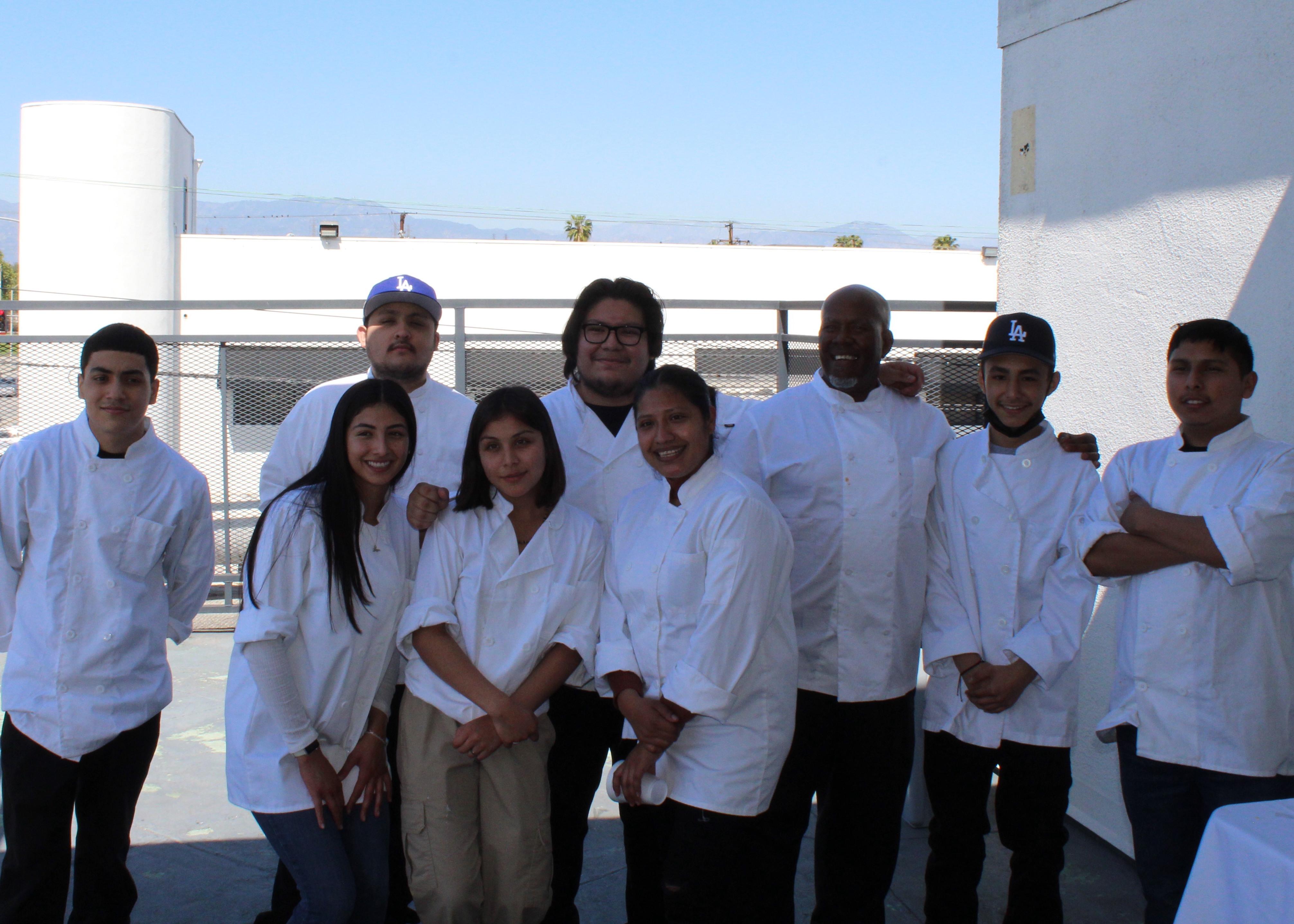 culinary students pose with Chef Orlando