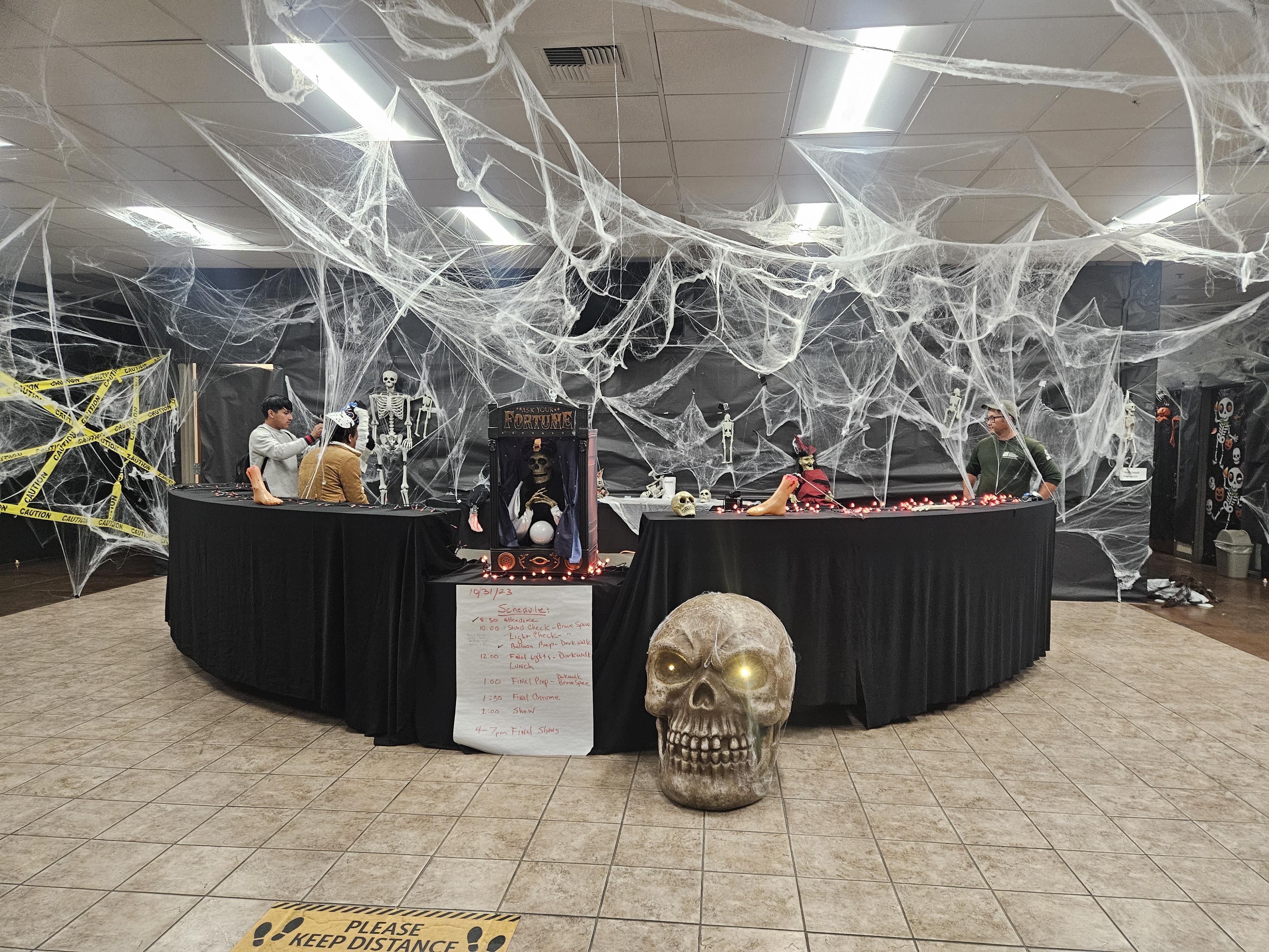 the reception area decorated with cobwebs and spooky decor