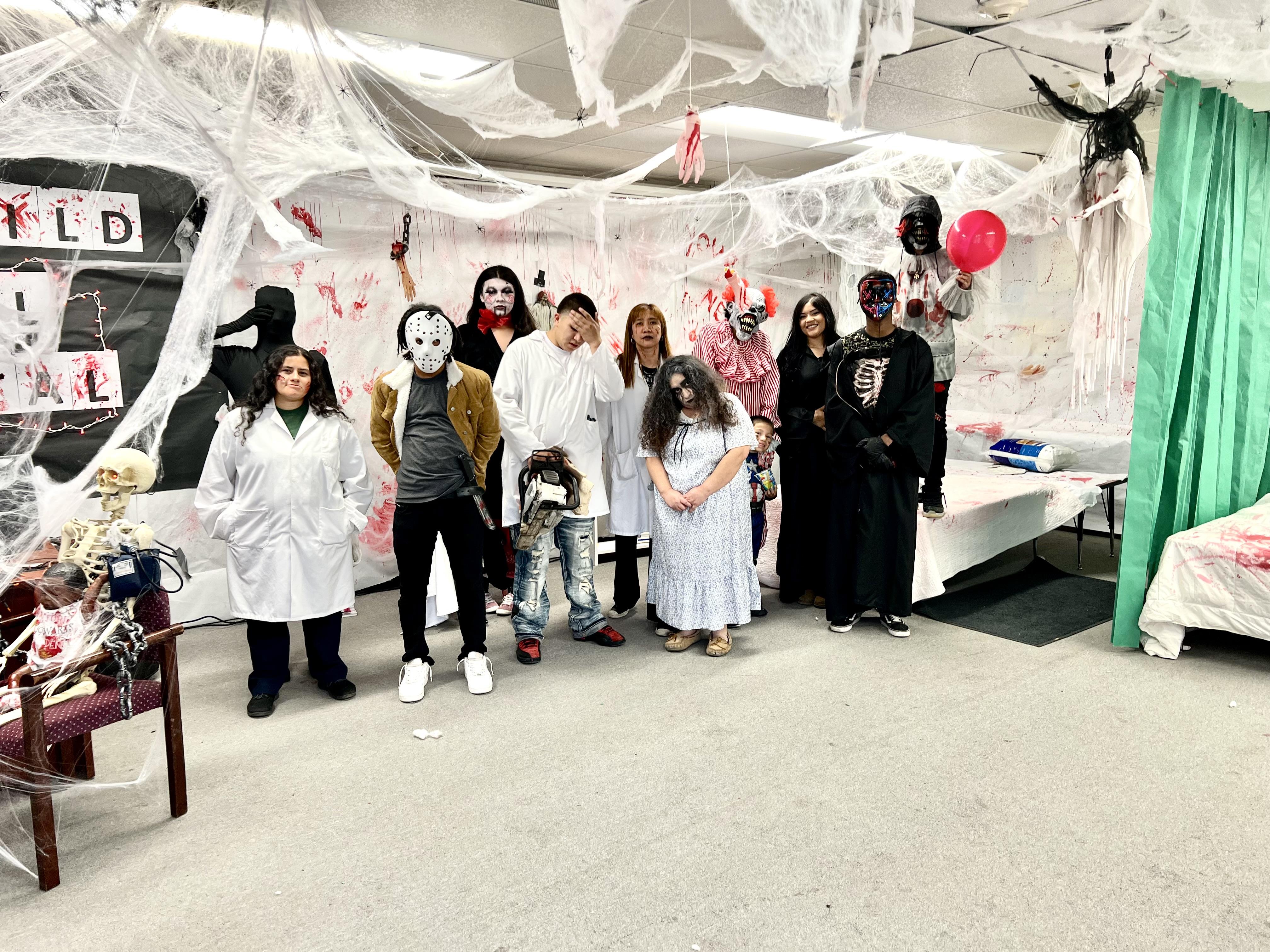 students and staff dressed in scary Halloween costumes
